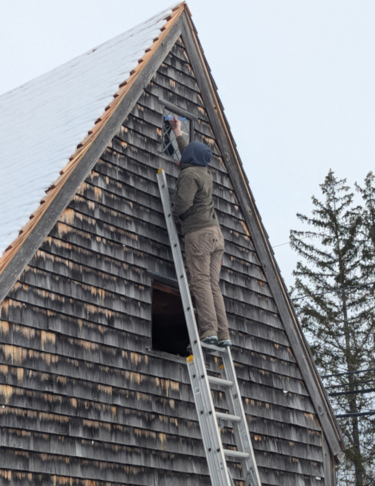 Worker removes third-floor west side window.